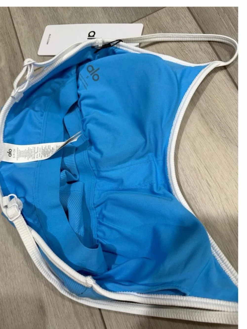 ALO Yoga Goddess Ribbed First Pick Bra Tank in Azure Blue with White Trim.